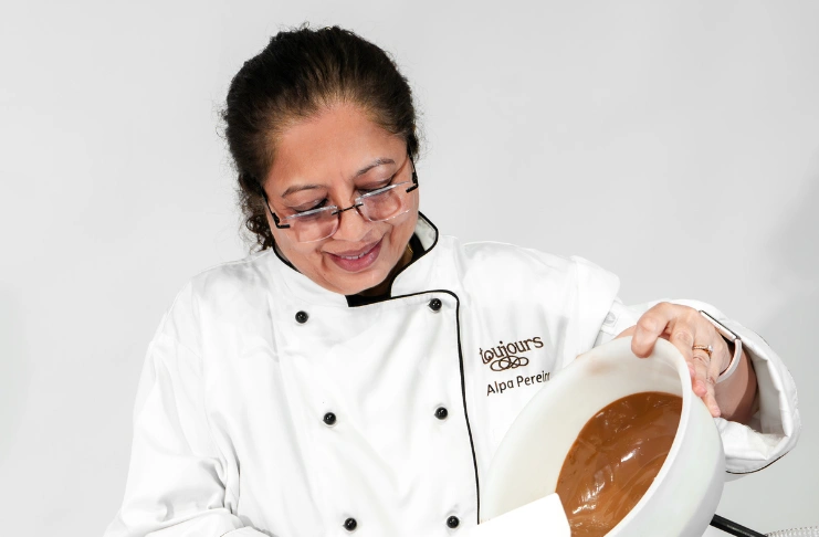 Alpa Pereira baking a cake at Toujours